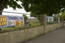 Organisations with banners on railings at the Stallard Street Recreation Field  opposite Holy Trinity Church were given three days to removed them or face prosecution.