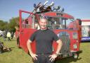 Firefighter Mark Truckle who brought the 1951 Dennis  fire engine to the show showing how fire engines used to look years ago.