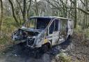 The white transit van, which was found in Flisteridge Woods near Minety, has been ravaged by flames