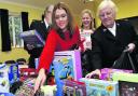 Jessica Hastie and Major May Hart and help sort the moutain of toys