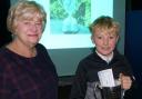 Oscar Oliver is presented with the Robert Hill Junior of the Year award at Marlborough Golf Club by Rosie Hill