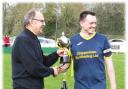Bath Road captain Tom Flynn collects the WG Parr Trophy after his side's victory over New Inn Wacker in the final. PICTURE: CADER ESOOF