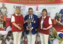 North Wilts players Alex Jacobs (left) and Sue Cooke with EIBA president Mark Cohen after their victory in the national O60 ladies pairs final