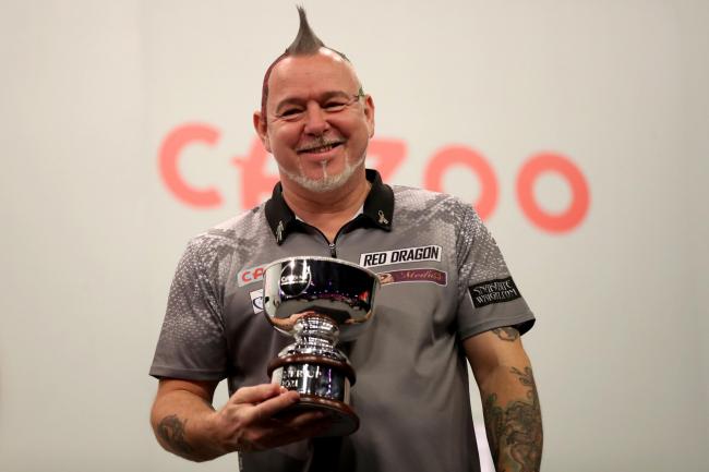 Peter Wright poses with his runner-up trophy at the Grand Slam of Darts