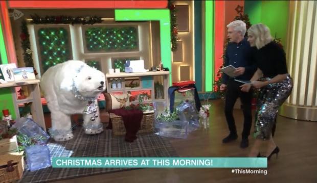 The Wiltshire Gazette and Herald: Holly and Phillip explore the christmas decorations in the This Morning studio. Credit: ITV