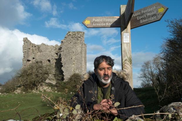 The Wiltshire Gazette and Herald: Nihal Arthanayake under a footpath sign next to Arnside Tower. Photo credit: BBC.