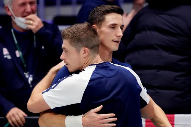 Joe Salisbury, right, and Neal Skupski celebrate after booking Britain's spot in the quarter-finals