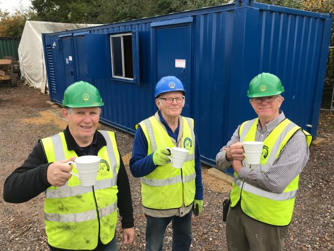 Volunteers Ray Canter, Basil Raddy and Dave Maloney enjoy a tea break in front of the charity’s new welfare unit at Pewsham Locks Photo: Justin Guy