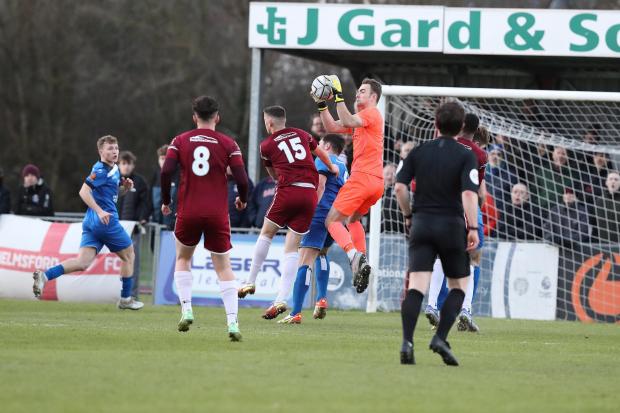 Chippenham Town goalkeeper Will Henry claims a high ball during his side’s 0-0 draw with Chelmsford City in National League South        Photo: Richard Chappell