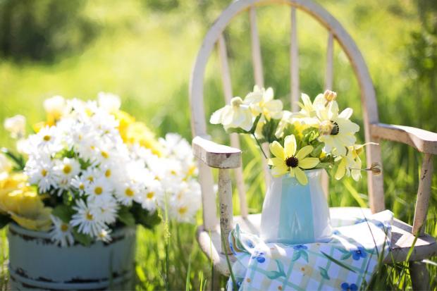 The Wiltshire Gazette and Herald: A white chair surrounded by flowers. Credit: Canva