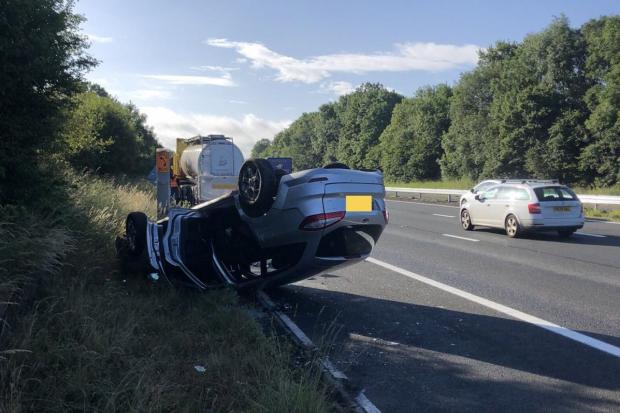 M4 traffic news: car flipped after crash with a lorry (Photo: Wiltshire Specialist Ops/Twitter)