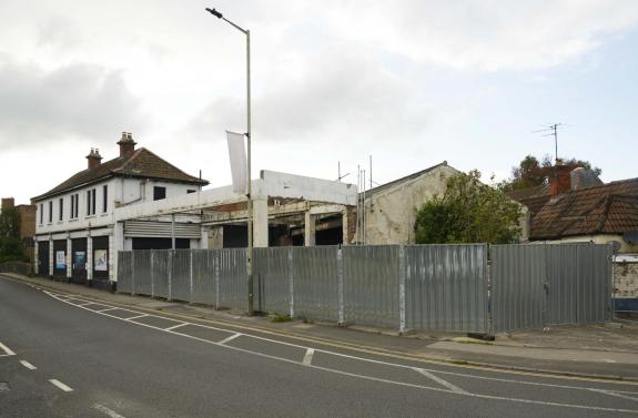 The Wiltshire Gazette and Herald: Metal shuttering has gone up around Trowbridge Town Bridge Garage site prior to its possible redevelopment. Photo: Trevor Porter 70139-2 The Wiltshire Gazette and Herald: Metal shuttering has gone up around Trowbridge Town Bridge Garage site prior to its possible redevelopment. Photo: Trevor Porter 70139-2