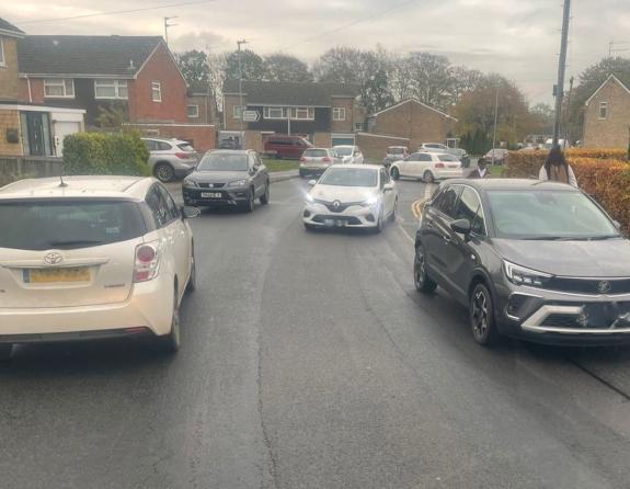 The Wiltshire Gazette and Herald: Cars parked on Queens Crescent, Chippenham, blocking a bus The Wiltshire Gazette and Herald: Cars parked on Queens Crescent, Chippenham, blocking a bus
