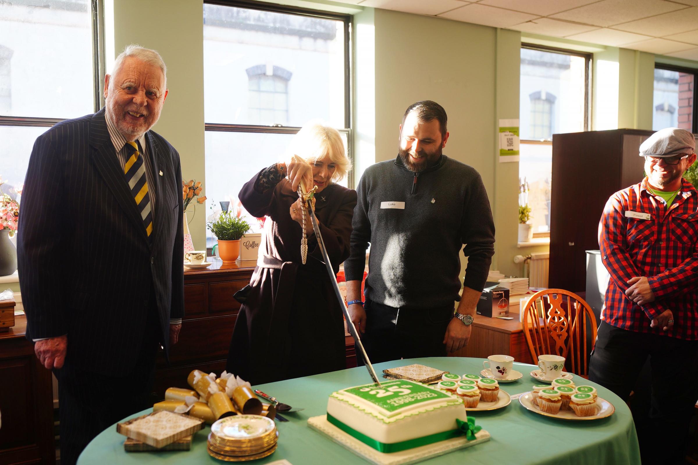 Queen cuts cake with sword as she celebrates charity's 25th birthday | The Wiltshire Gazette and Herald - Vimarsana News