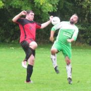 Action from the clash between Foresters Arms (green) and Sutton Benger. PICTURE: Cader Esoof