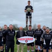 Henchman general manager Michael Byers with  Royal Wootton Bassett RFC head coach Alan Low and his squad