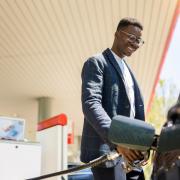 Man filling up his car with petrol.
