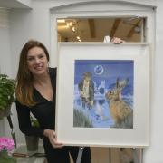 Joanna May with her Moonraker painting at her gallery in Devizes. Photo: Trevor Porter 69445-2