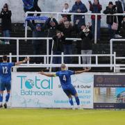 Chippenham Town defender Spencer Hamilton celebrates a rare goal in front of the travelling fans on Boxing Day                Photo: Richard Chappell