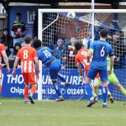 Chippenham Town striker Craig Fasamade sees his header ruled out for an apparent offside Photo: Richard Chappell