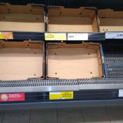 Empty fruit and vegetable shelves in Sainsburys, Devizes