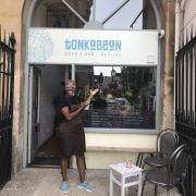 Abrilli Phillip in front of Tonka Bean Cafe and Bar