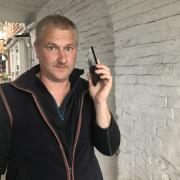 Matthew Richardson with his destroyed Google Phone