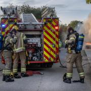 Firefighters tackle the car fire in Malmesbury