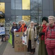 Wiltshire Climate Alliance members listen to the councillors outside County Hall.