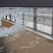 A burglar broke a convenience shop window to steal a parcel