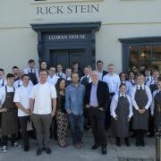 Rick Stein and the restaurant team standing outside the restaurant at Lloran House