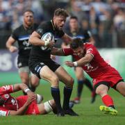 Bath's Rhys Priestland is tackled by Toulouse Zack Holmes  the European Champions Cup match at the Recreation Ground, Bath. PRESS ASSOCIATION Photo. Picture date: Saturday October 13, 2018. See PA story RUGBYU Bath. Photo credit should read: David