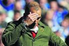 Swindon Town boss Paolo Di Canio cuts a crestfallen figure at Wembley
