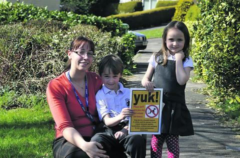 Luke and Tamsin Mundy with mum Victoria Townsend fed up with bags of dog mess being left outside their home in Corsham