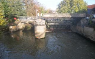 Environment Agency teams working on the stuck gate at Chippenham