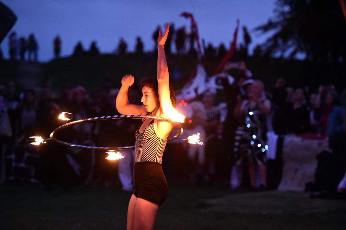 2014 Playing with fire at Avebury Stones Summer Solstice evening celebrations Photo Diane Vose.